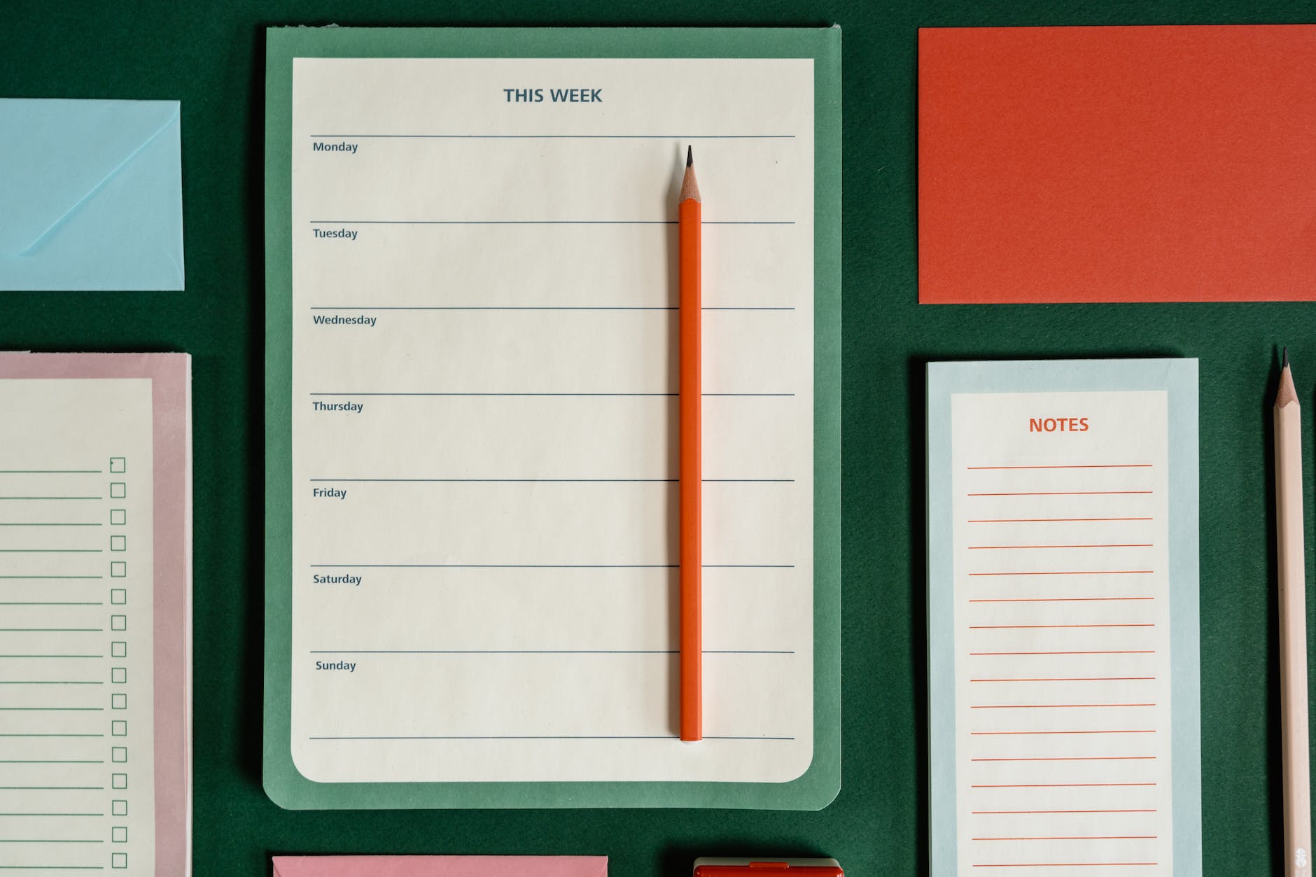 stationery on green surface