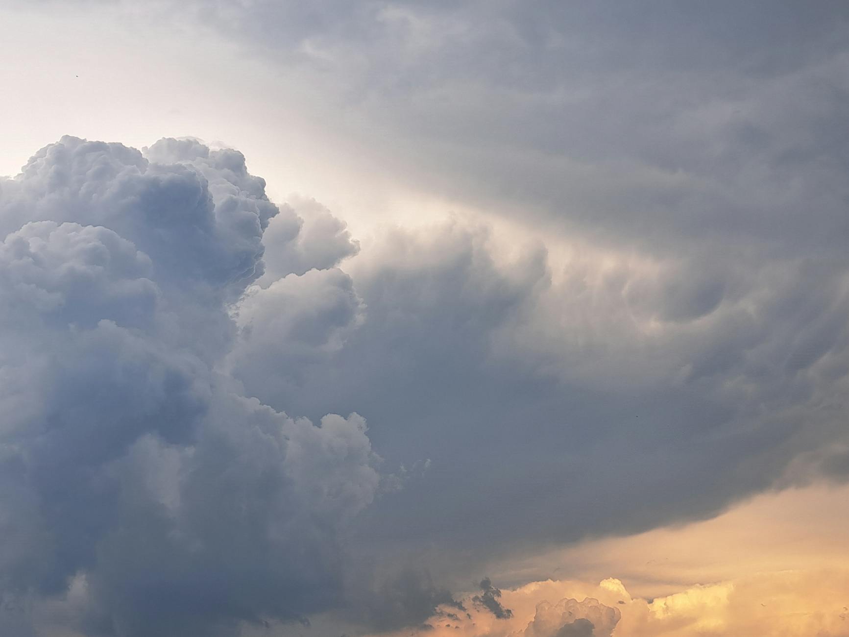 a large cloud is seen in the sky