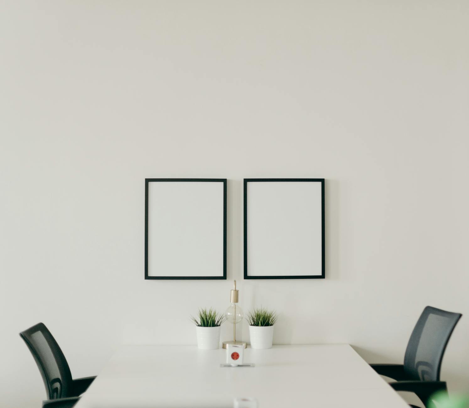 white wooden table with chairs in a room