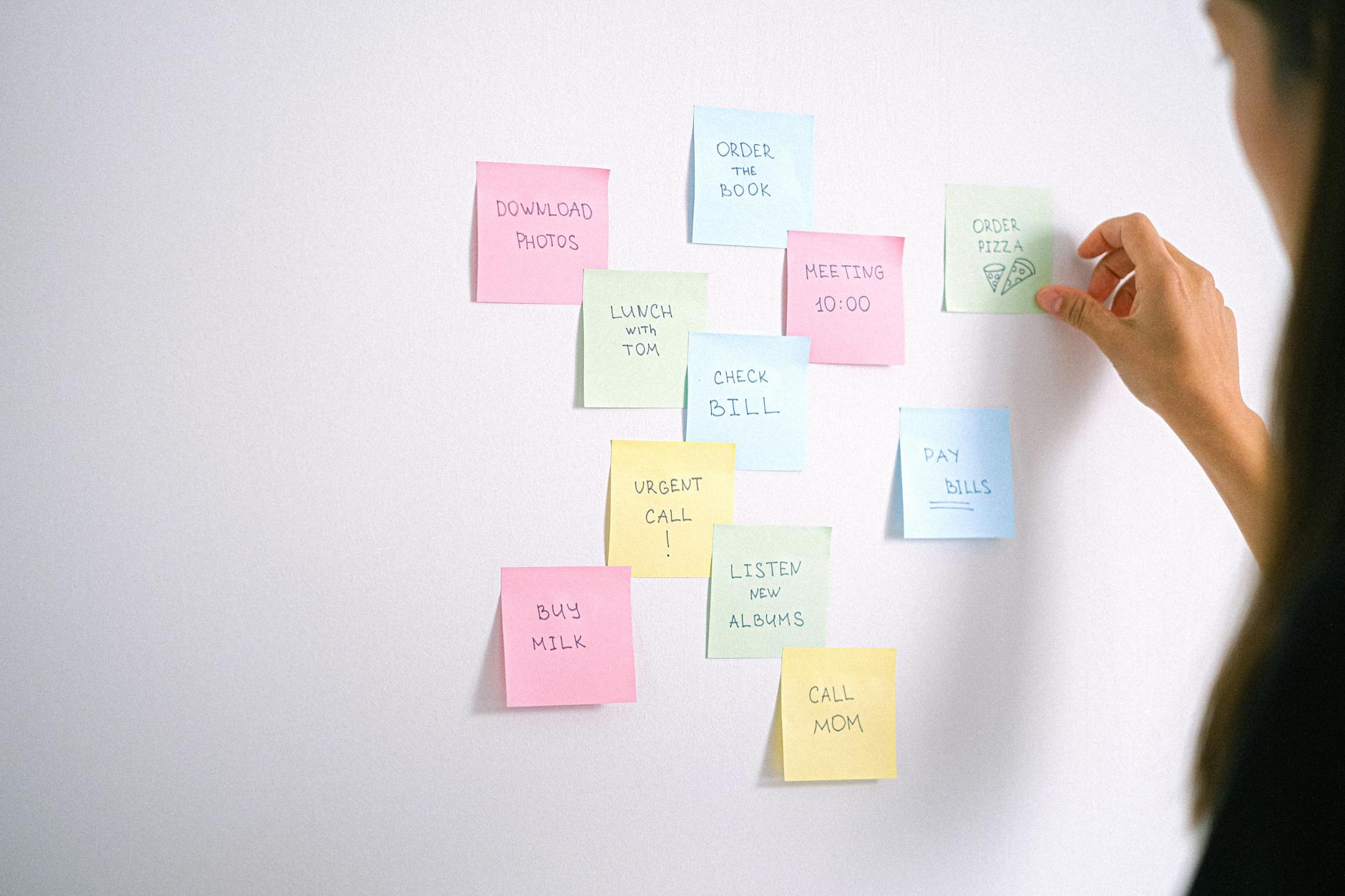 sticky notes with to do list on the white wall