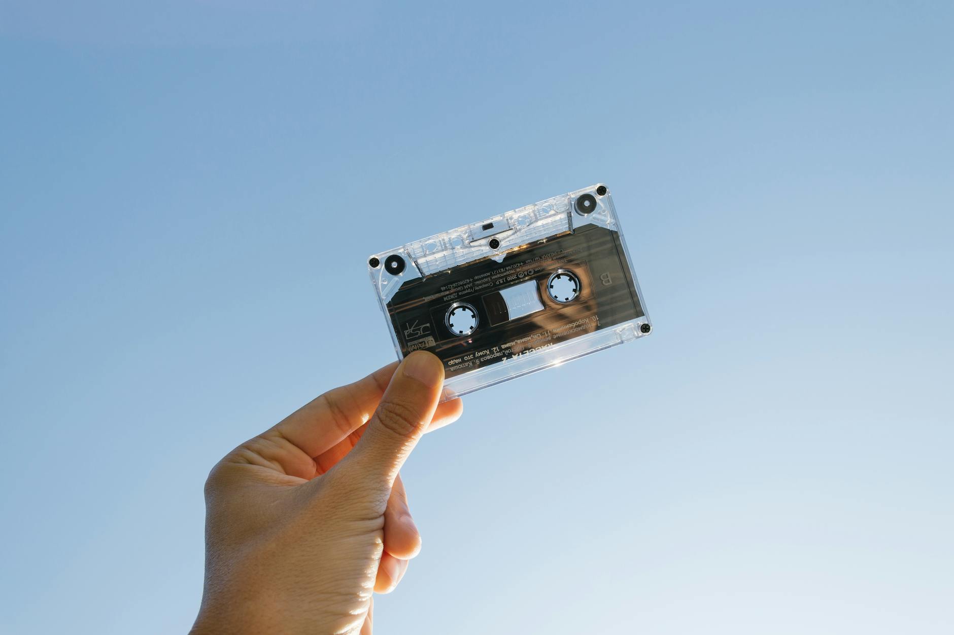 person holding cassette